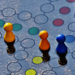 A board game showcasing vibrant, multicolored pieces arranged on the playing surface.